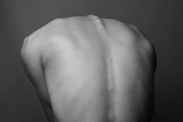 A greyscale study of a person's back